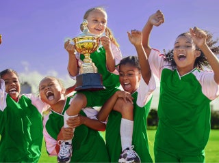 Children holding the cup